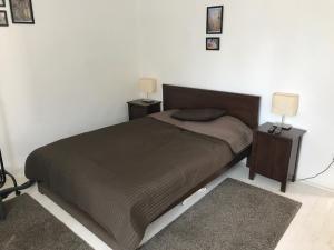 Posteľ alebo postele v izbe v ubytovaní Gólyásház apartman