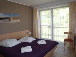 Postel nebo postele na pokoji v ubytování Hotel Bergmühle