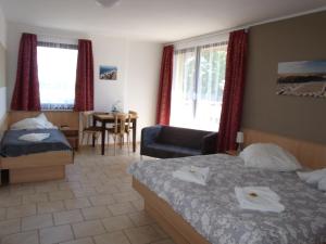 Postel nebo postele na pokoji v ubytování Hotel Bergmühle