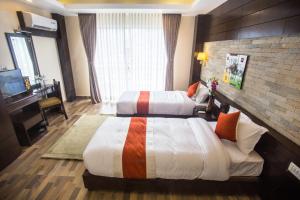 Postel nebo postele na pokoji v ubytování Bodhi Suites Boutique Hotel and Spa