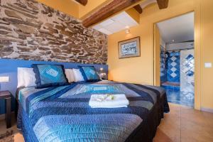 Postel nebo postele na pokoji v ubytování Hotel Cal Llop