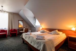 Postel nebo postele na pokoji v ubytování Hotel Skalite Spa & Wellness