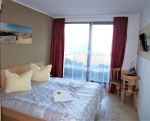 Postel nebo postele na pokoji v ubytování Hotel Bergmühle