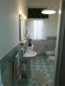 a bathroom with a sink and a toilet at Le Terrazze in Carini