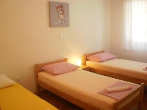 Postel nebo postele na pokoji v ubytování Apartment Lana