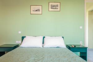 Posteľ alebo postele v izbe v ubytovaní Villaggio Verde
