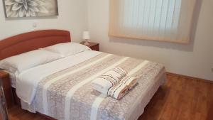 Posteľ alebo postele v izbe v ubytovaní Villa Crikvenica