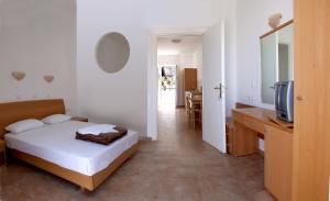 A bed or beds in a room at Lambis Studios & Apartments