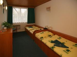 Postel nebo postele na pokoji v ubytování Hotel Gól garni