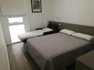 Cama o camas de una habitación en Hotel Alguer Camp Nou