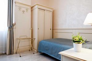 Postel nebo postele na pokoji v ubytování Nouvel Hotel Des Bains