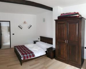 Postel nebo postele na pokoji v ubytování CASA Fratii MÂT