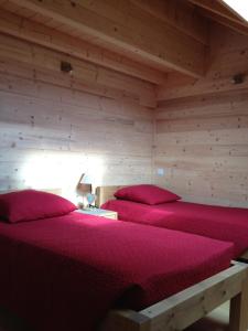 Ένα ή περισσότερα κρεβάτια σε δωμάτιο στο Au cœur du bois