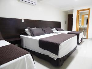 Postel nebo postele na pokoji v ubytování Master Gold Hotel Express