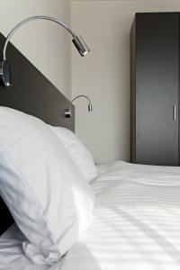 Postel nebo postele na pokoji v ubytování Hotel AM Fang