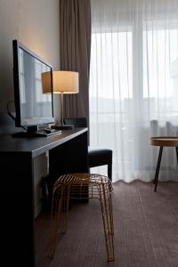 TV a/nebo společenská místnost v ubytování Hotel AM Fang