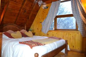 Cama ou camas em um quarto em Cabañas Bosque Del Faldeo