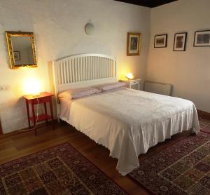 Postel nebo postele na pokoji v ubytování Antico Borgo Camporeso