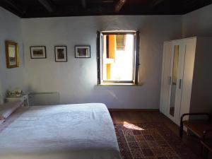 Postel nebo postele na pokoji v ubytování Antico Borgo Camporeso