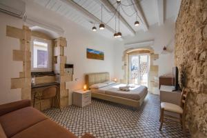 Postel nebo postele na pokoji v ubytování B&B Bianco E Blu