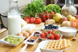 a table topped with lots of different types of food at Hostel Mostel Hub Rooms and Apartments in Sofia