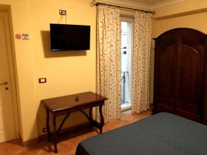 TV a/nebo společenská místnost v ubytování Apollo B&B