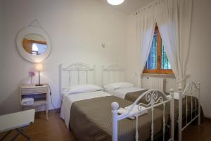 Postel nebo postele na pokoji v ubytování B&B Brunone