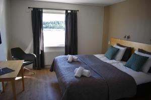Postel nebo postele na pokoji v ubytování Håveruds hotell och konferens