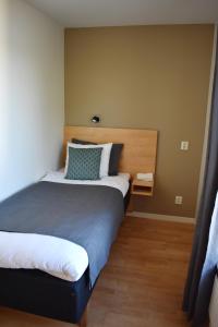 Postel nebo postele na pokoji v ubytování Håveruds hotell och konferens