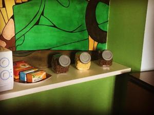 a shelf with three different types of food on it at Casa Albergo La Terza Stella in Agira