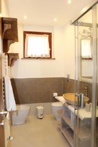 a bathroom with a sink and a toilet and a shower at Seaview Apartment Monterosso, Cinque Terre in Monterosso al Mare