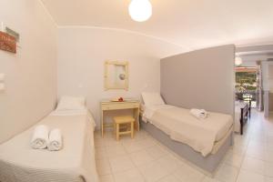 מיטה או מיטות בחדר ב-Minas Apartments