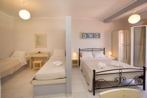 מיטה או מיטות בחדר ב-Minas Apartments