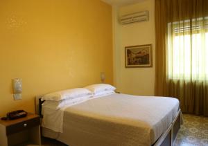 Łóżko lub łóżka w pokoju w obiekcie Hotel Sole