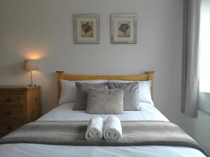 a bedroom with a bed with two towels on it at The annex at 44 Belvidere Road in Shrewsbury +7 photos