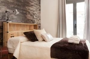 A bed or beds in a room at Apartment Beach Front Canet