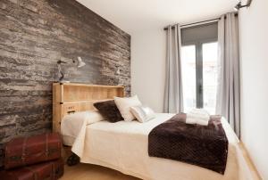 A bed or beds in a room at Apartment Beach Front Canet