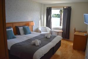 Postel nebo postele na pokoji v ubytování Håveruds hotell och konferens