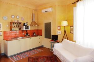 A bed or beds in a room at Poggio Imperiale Apartments