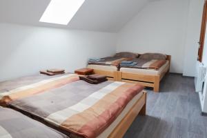 Postel nebo postele na pokoji v ubytování Penzion U Římských