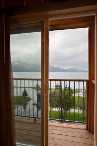 a room with a view of the water and mountains at Hotel Edgewater in Seward