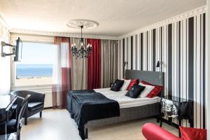 Ένα ή περισσότερα κρεβάτια σε δωμάτιο στο Hotel Rantakalla