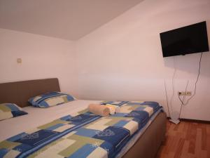 Postel nebo postele na pokoji v ubytování Apartment Lena