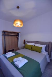 Un pat sau paturi într-o cameră la Aqua Marine