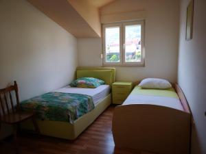 Postel nebo postele na pokoji v ubytování Apartment Lena