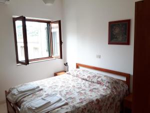 Postel nebo postele na pokoji v ubytování Parigino