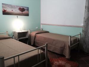 A bed or beds in a room at Villetta al Mare Marsala