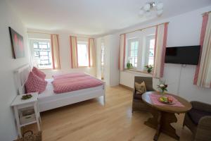 a small room with a bed and a table at Feldmann-Schütte in Schmallenberg