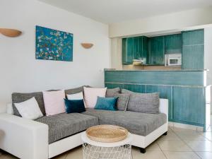 a living room with a couch and a table at Holiday Home Las Estancias by Interhome in Denia