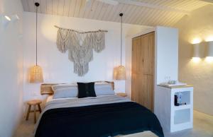 A bed or beds in a room at Yacht Boheme Hotel-Boutique Class - Adults Only
